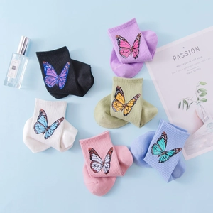 Set of 6 colorful combed cotton crew socks with vibrant butterfly patterns for women