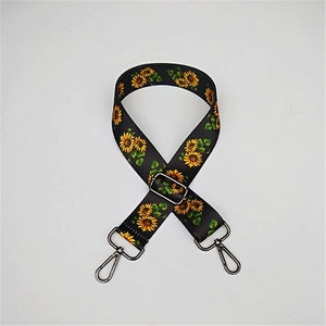 Adjustable wide replacement bag strap with vibrant yellow sunflower print and metal hooks