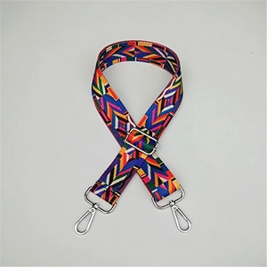 Close-up of colorful ethnic geometric adjustable strap with silver metal lobster clasps
