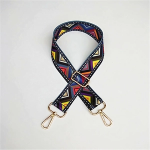 Close-up of colorful ethnic geometric pattern woven strap with gold metal lobster clasps