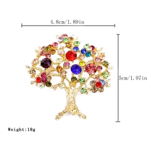 Golden tree brooch with colorful rhinestones measuring 4.8cm wide and 5cm high