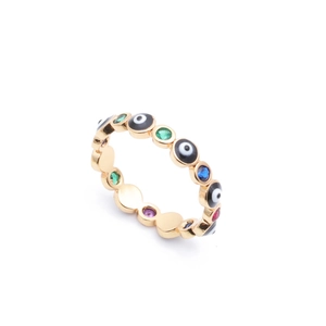 Detailed macro view of gold evil eye ring with multi-color zircon stones and gemstones