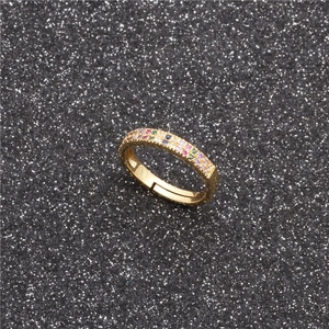 Adjustable gold open ring featuring two rows of colorful cubic zirconia on black background