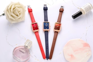 Detailed view of rectangular watches with malachite texture dials in leather straps