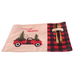 Linen Christmas placemat with red truck embroidery and cutlery pocket on white background