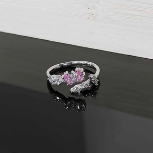 Close-up of pink marquise stones and white zircon on silver adjustable leaf ring