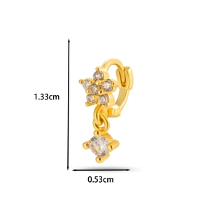 Detail of gold ear cuff with star and round zircon pendants showing size measurements