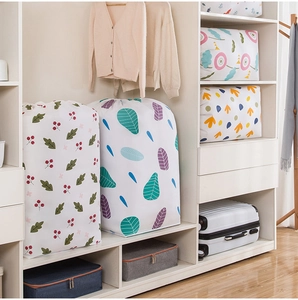 Waterproof PEVA storage bags with floral patterns organized neatly inside a modern white closet