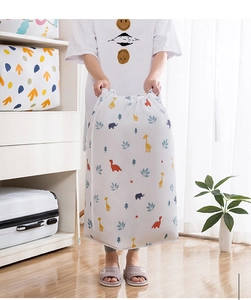 Detailed view of large cylindrical drawstring storage bag with colorful cartoon animal print