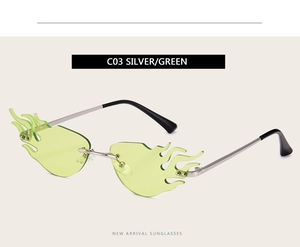 Detail of silver frameless sunglasses with flame shaped green lenses and metal temples