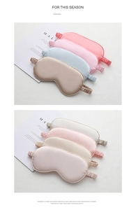 Detail of assorted silk sleep masks with elastic bands in soft pastel colors