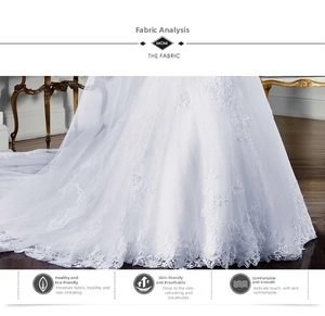 Détail de la jupe de robe de mariée blanche avec broderie florale en dentelle fine