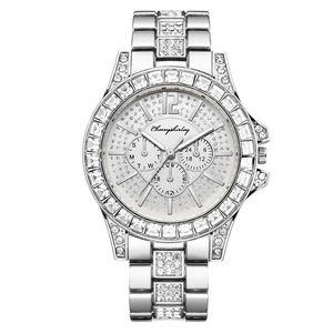 Detailed macro view of luxury diamond encrusted women's quartz watch with silver steel band