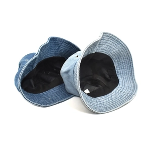 Classic washed denim bucket hats in dark and light blue colors on a white background