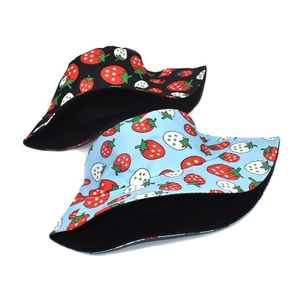 Double-sided strawberry print bucket hat in black and light blue for casual outdoor wear