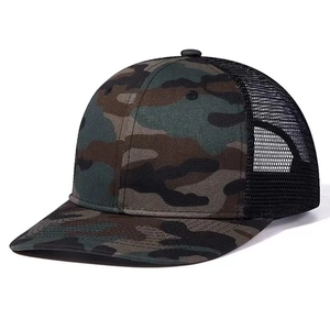 Forest camouflage trucker hat with breathable black mesh and curved visor outdoors