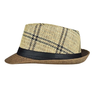 Close-up of a two-tone woven fedora hat with a black ribbon band and textured straw finish
