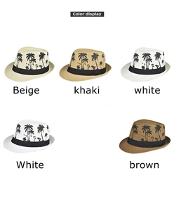 Detailed color display of straw fedora hats with black tropical coconut tree prints