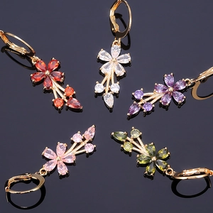 Detail view of five multicolor floral drop earrings with marquise cut cubic zirconia