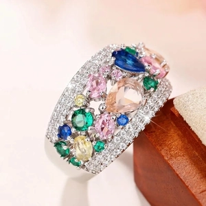 Geometric silver ring with multicolored rainbow gemstones in a vibrant teardrop design