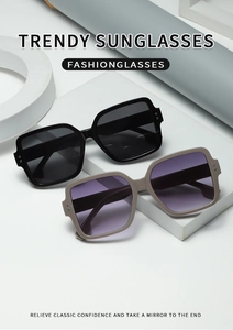 Close-up of trendy square rivet sunglasses featuring polished frames and gradient lenses