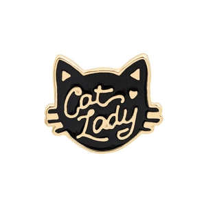 Detail of a black and gold enamel cat-shaped pin featuring Cat Lady text on white background