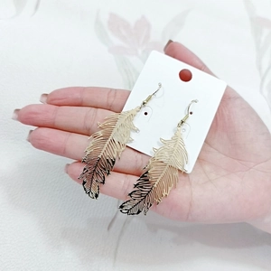 Elegant rose gold wing shaped earrings with intricate hollow feather texture for women