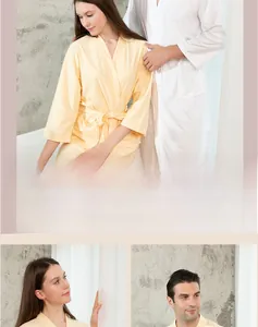 Detail of couple's waffle weave robes showing the soft texture and waist tie design