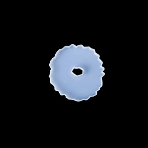 Close-up of wavy edge circular silicone mold for resin coaster with pentagon hole