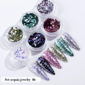 Detail view of 6-color glitter nail art sequin set with assorted sparkling manicured tips