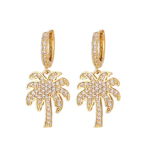 Golden palm tree dangle earrings with sparkling white crystals for a summer resort style