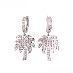 Detail view of palm tree earrings with intricate micro-pave zircons and silver finish