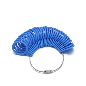 Close-up of blue plastic ring sizer rings with US 0-13 and UK A-Z sizes on steel wire