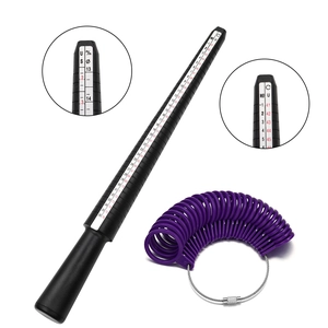 Black and purple ring sizer set with measuring mandrel and gauge rings on white background