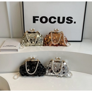 Detailed view of luxury sequined evening bags with pearl clasps in four elegant colors
