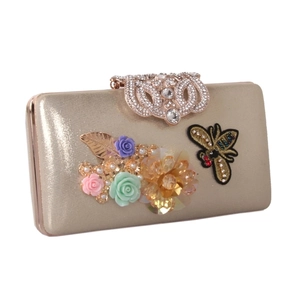 Elegant gold evening clutch with 3D satin flowers, pearls and embroidered bee detail