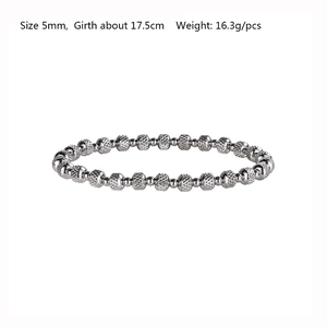 Detail of 5mm silver stainless steel beaded bracelet showing textured surface and dimensions
