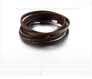 Detailed view of multilayer brown braided leather bracelet with stainless steel clasp