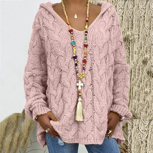 Detailed knit texture of pink cable knit hoodie sweater with elegant V-neck and hood