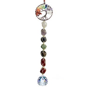 Detail of handmade Tree of Life car charm with seven chakra stones and a crystal ball