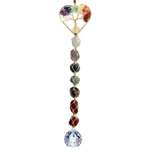 Detail of life tree hanging decor with natural colorful crystals and multifaceted glass ball