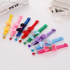 Detailed set of eight colorful polka dot pet collars with bows and bells for cats and dogs