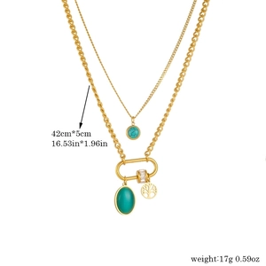 Double-layered gold titanium necklace featuring turquoise and oval green stone pendants