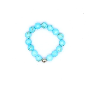 Detailed macro view of 4mm turquoise stone elastic ring with polished silver bead accent