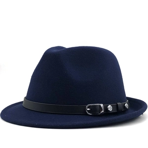 Detail of navy blue wool fedora with a black leather band and silver metal rivets