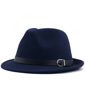 Detail of dark blue fedora hat featuring black leather band and silver metal buckle