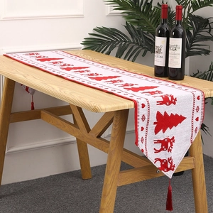 Knitted Christmas table runner with red reindeer, snowflake patterns and festive tassels