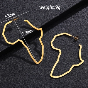 Detailed view of large gold African map earrings with size 53mm x 72mm on black texture