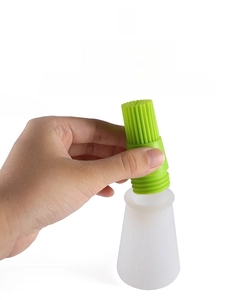 Detail of leakproof silicone oil brush bottle with threaded head for even dispensing