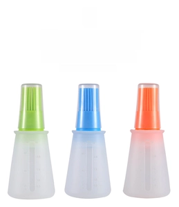Detail of 60ml silicone oil brush bottles with scale markings in green blue and orange